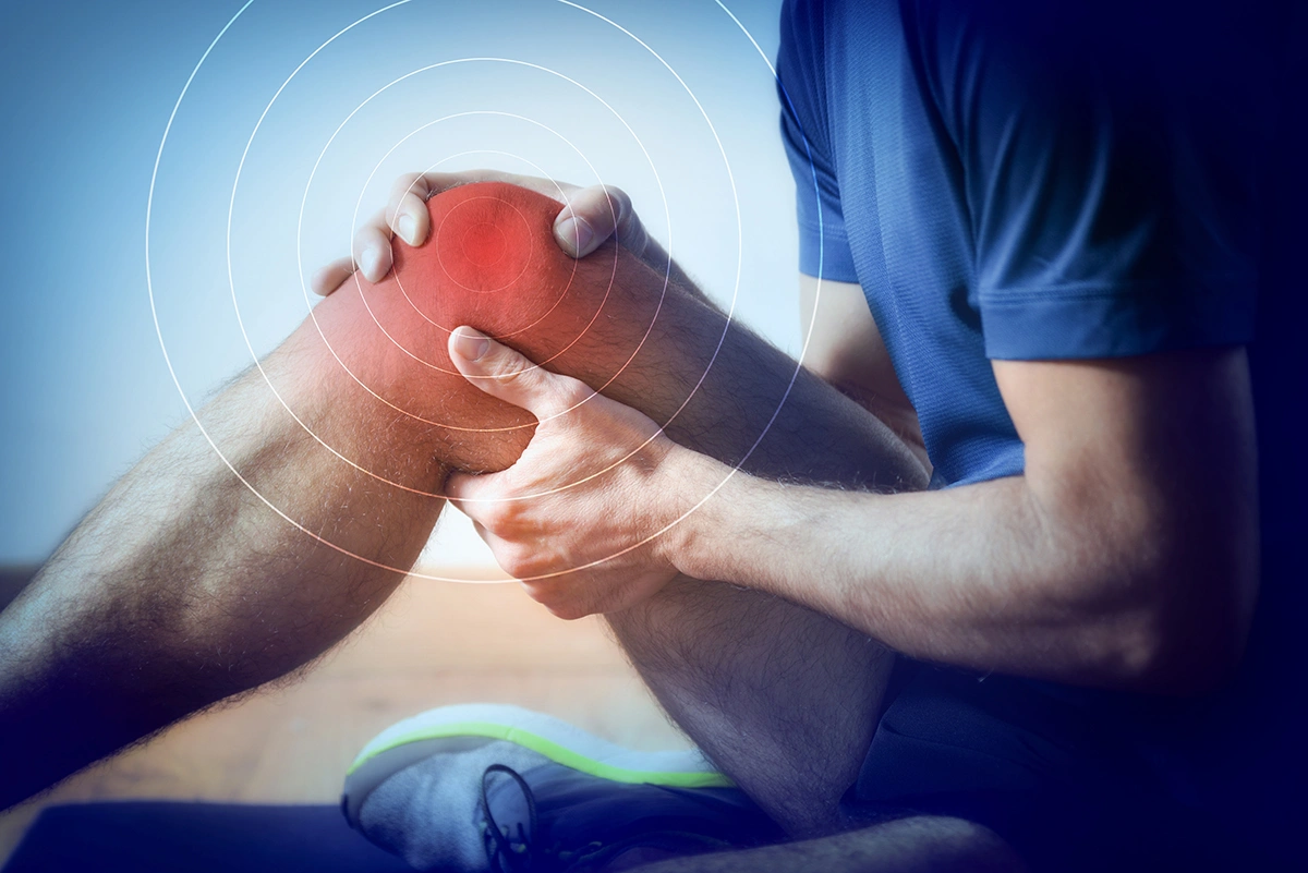 A man suffering from severe knee pain