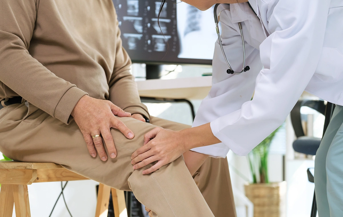 A patient receiving treatment from a knee pain specialist